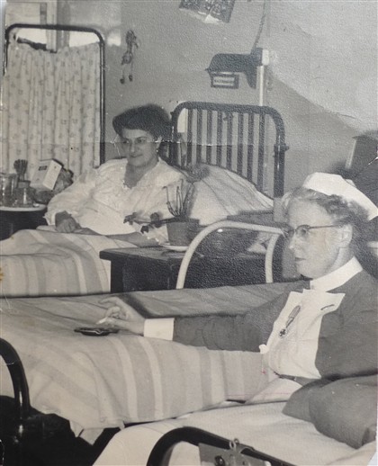 Photo:In this picture that Carla talks about, a nurse at St. Peter's hospital smokes next to Carla's mother's hospital bed.